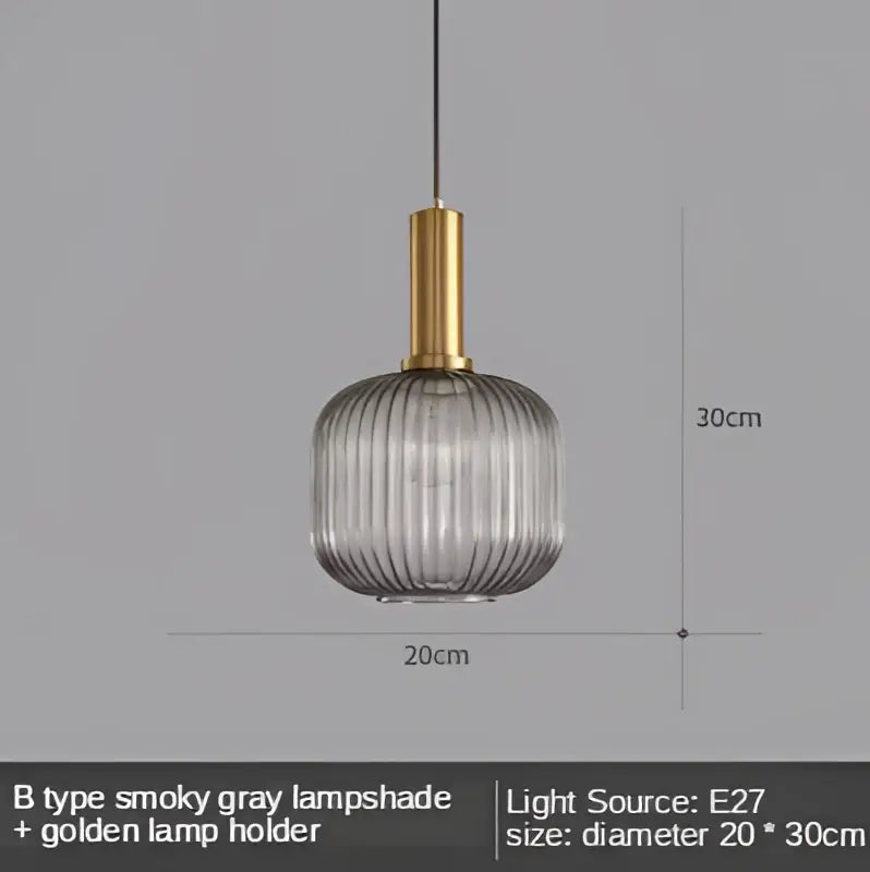 A sleek modern Nordic gray glass led pendant light with ribbed texture and gold-toned holder for dining room