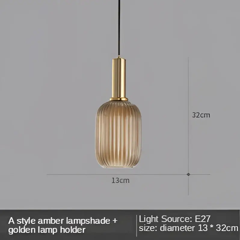 A sleek amber glass led pendant light with golden metal holder and vertical ridges, perfect for dining room use