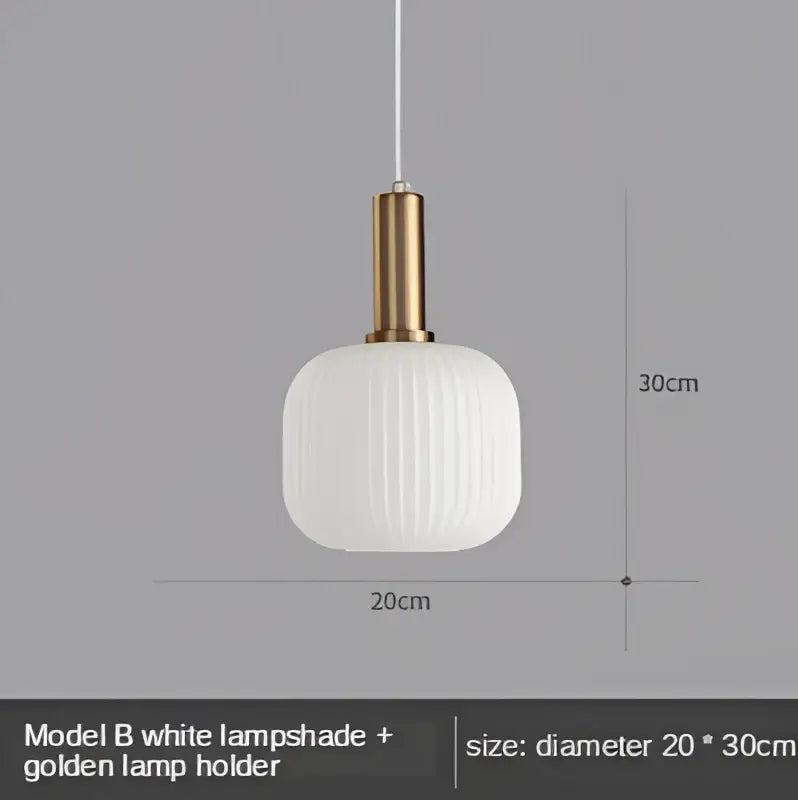Modern nordic pendant lights with a white ribbed glass led shade and golden metal holder for dining room lighting