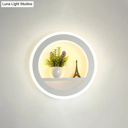 Modern nordic wall light with sleek white frame bulb included features integrated led ring and illuminated shelf with decor