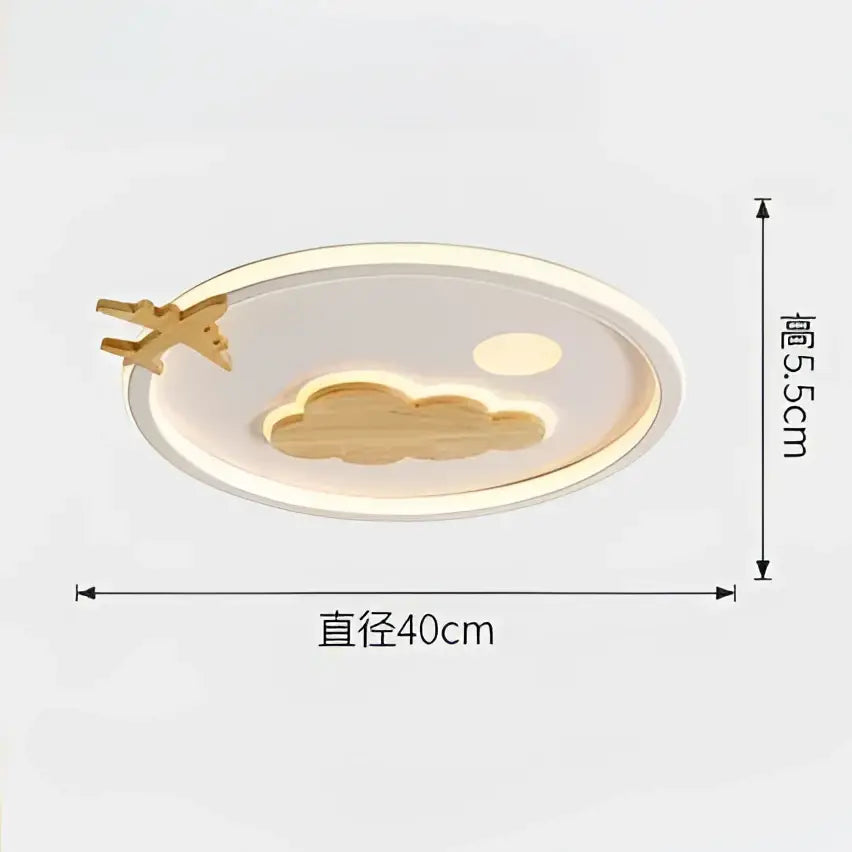 A modern nordic white decorbites cloud lamp with golden airplane and cloud motif illuminated by soft led lighting