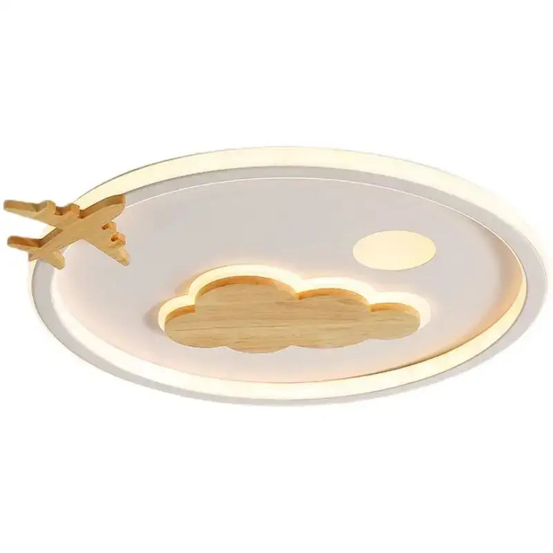 A modern nordic white decorbites cloud lamp with wooden airplane and glowing cloud cutouts for bedroom lighting