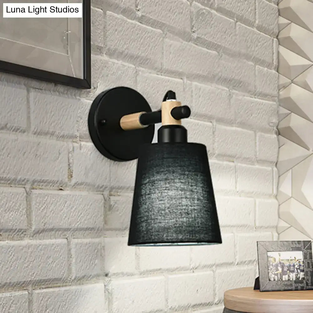 Modern nordic wood wall lamp with black horn shade, matte black metal base, light wood accents, suitable as bedroom sconce