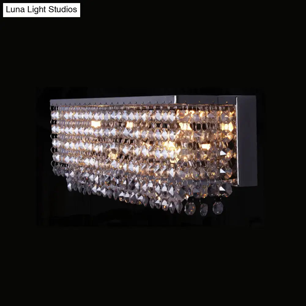 Modern octagon crystal wall light with clear crystal beads and teardrop crystals in polished chrome finish bedroom sconce