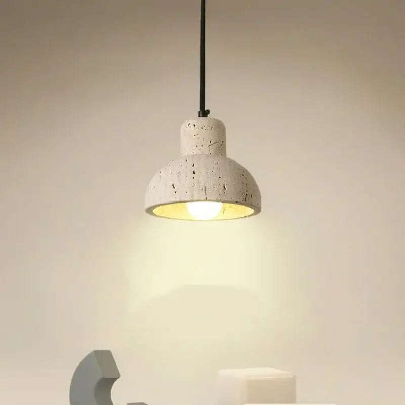 Modern off white cave stone led pendant light with rustic concrete finish and warm yellow glow for dining room decorbites cave stone