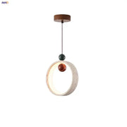 Modern off-white travertine pendant light with textured circular frame and amber and green beads by decorbites adjustable led pendant