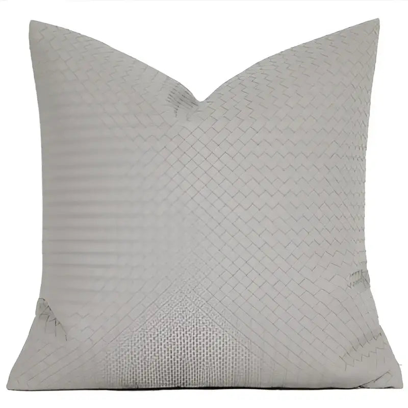 A light gray throw pillow with subtle woven texture featuring decorbites geometric faux leather pillow cover design