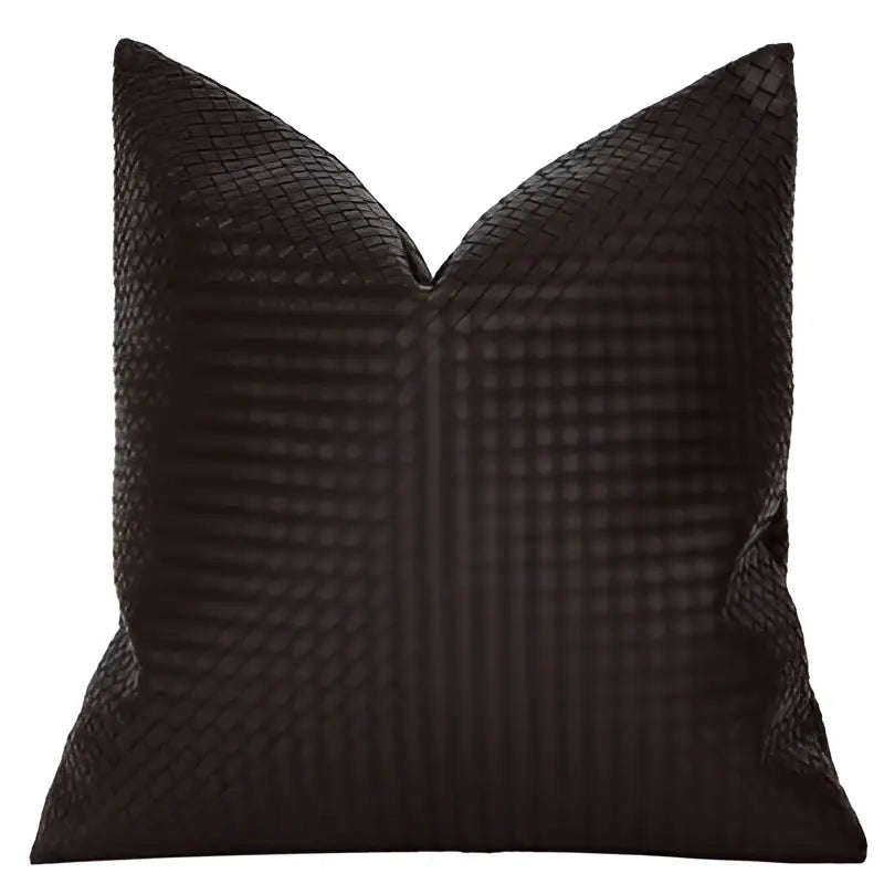 Black woven pillow cover with textured interlaced pattern complementing decorbites geometric faux leather decor