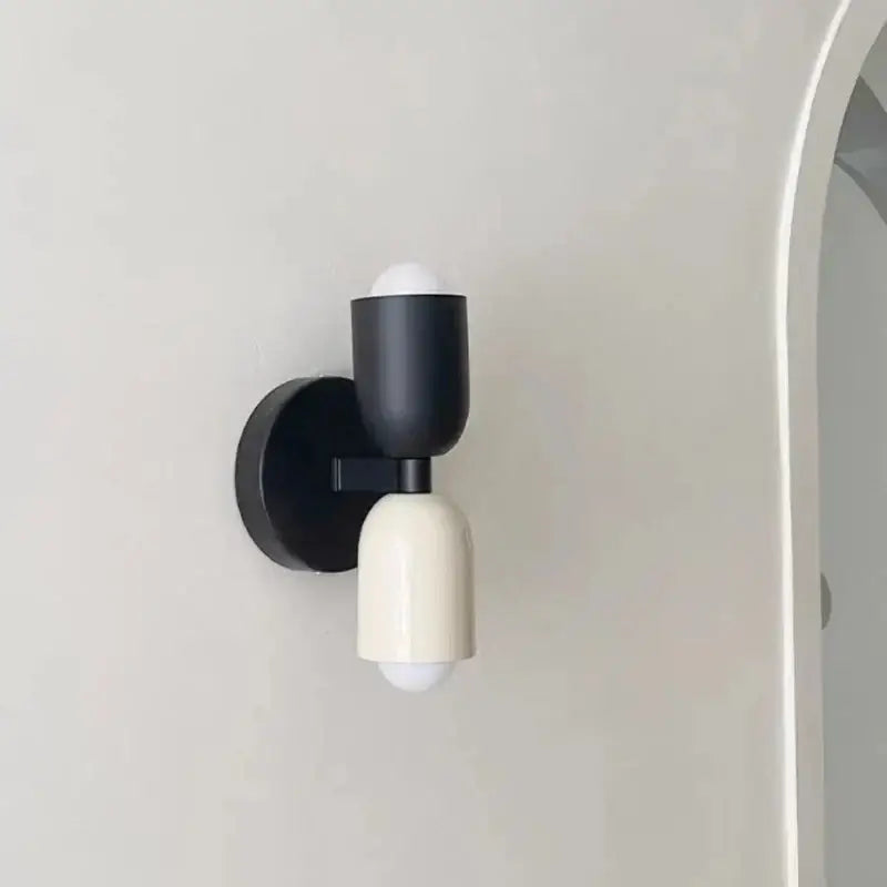 Black and cream decorbites cream double head wall lamps with matte metal arms for modern bedroom decor