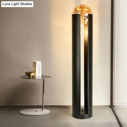 DecorBites modern black metal floor lamp with amber glass globe and linear capsule arch design 110v-120v