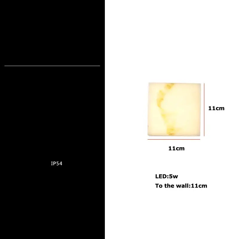 Modern onyx amber geometric led outdoor wall sconce with warm yellow glow and subtle marbled texture decorbites geometric led