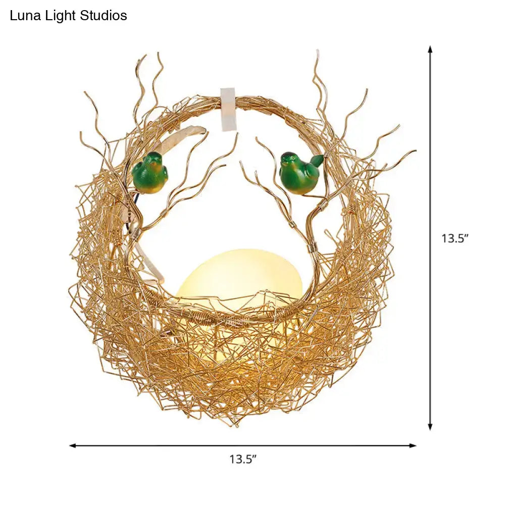 Modern opal glass bird nest sconce light with golden wire nest and green bird figurines for living room lighting
