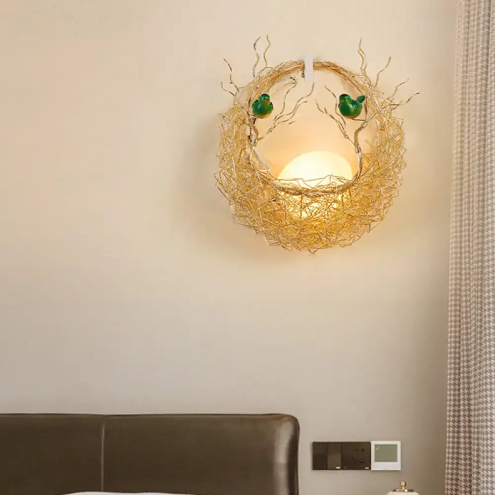 Modern opal glass sconce light with warm-toned bird nest design and green birds for living room wall decoration