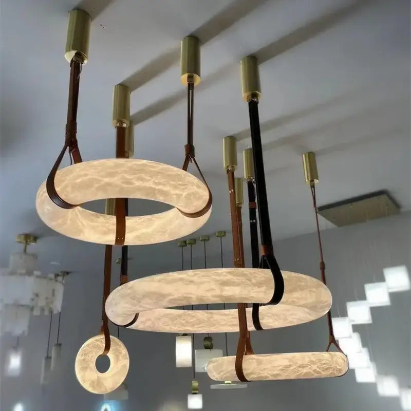 Modern opal glass ring marble chandelier pendant light with warm textured glass rings and brass fixtures by decorbites classic ring