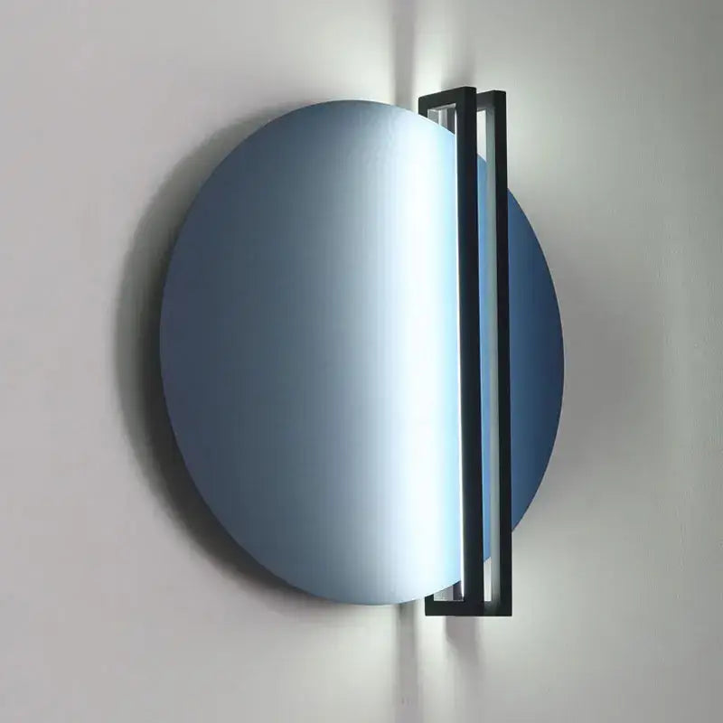 Modern orange and black circular wall lamp featuring a blue circular wall sconce with a sleek black frame by decorbites circular wall lamp