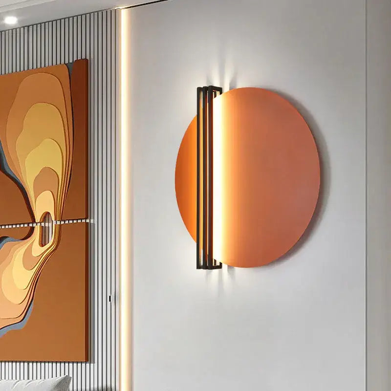 Modern orange and black circular wall lamp with sleek black metal frame for bedroom decorbites circular wall lamp