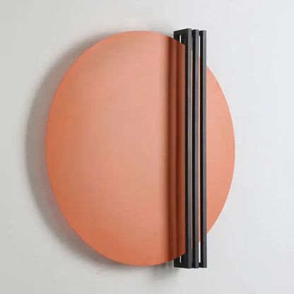 Modern orange and black circular wall lamp with sleek matte coral finish and minimalist black vertical bar for bedroom decorbites circular wall lamp