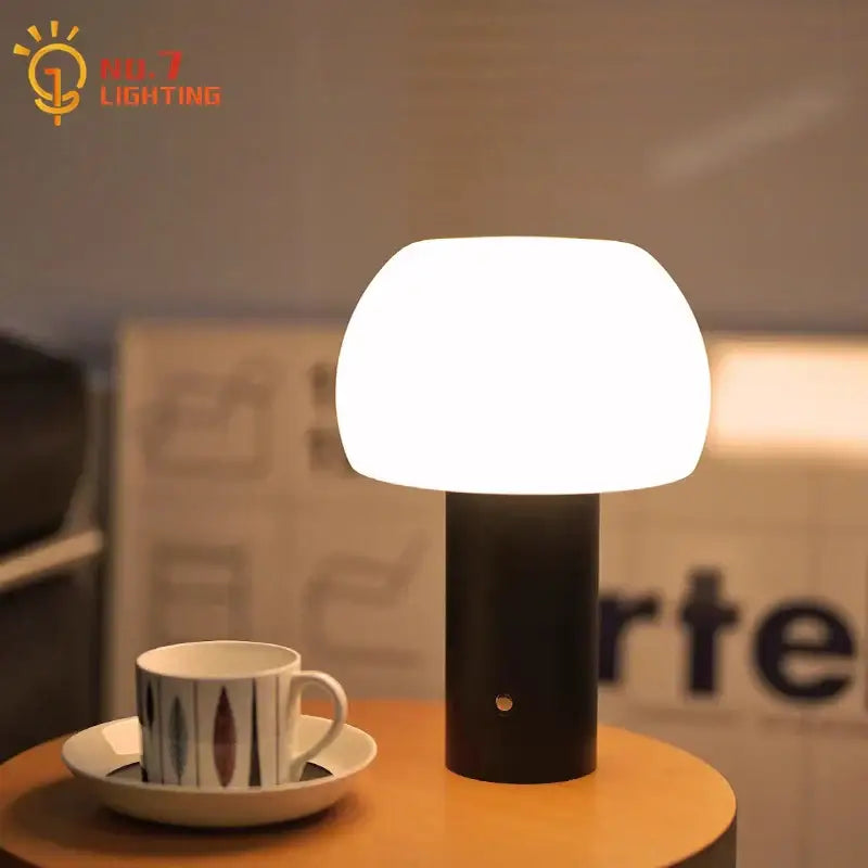 Modern black cylindrical atmosphere mushroom table lamp with smooth white glass shade for bedroom desk decorbites ambiance