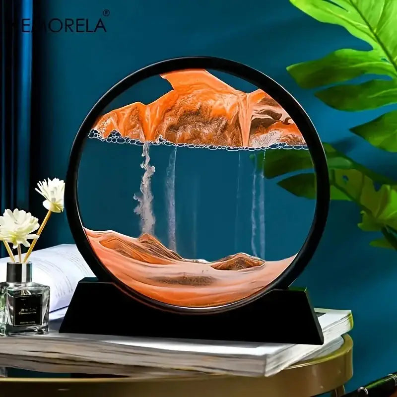 Modern orange and brown 3d moving sand art picture with circular black frame and desert landscape waterfalls decor