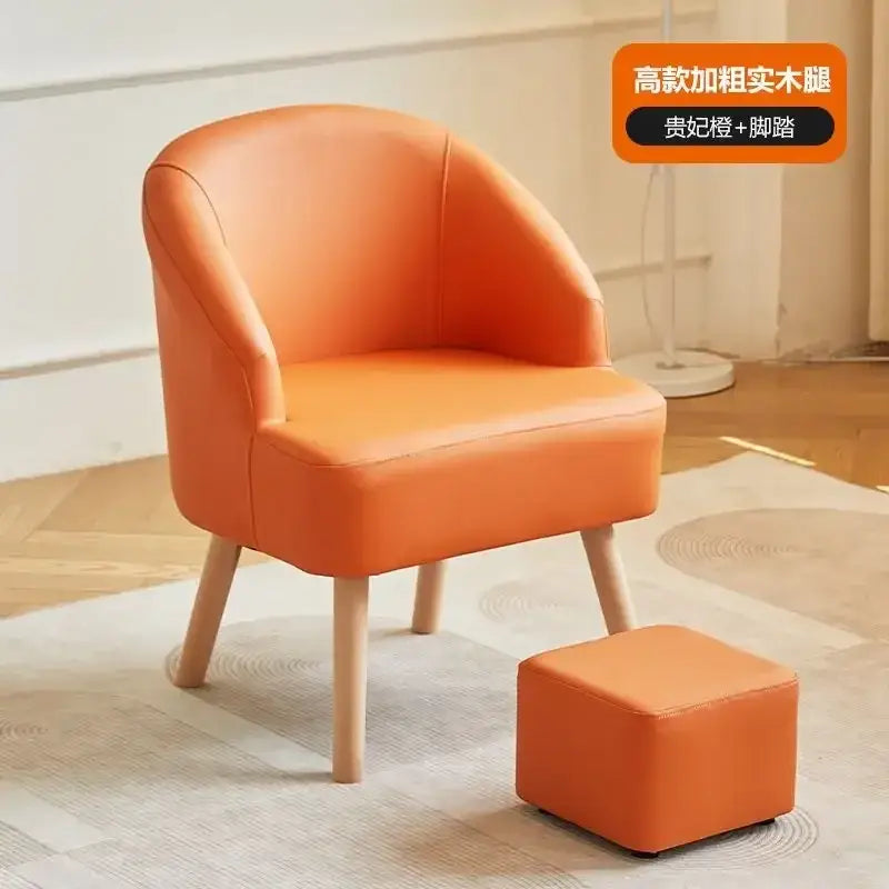 Modern orange and cream leather single sofa chair with matching ottoman and light wood legs for living room use