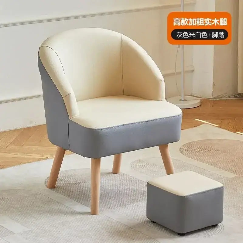 Modern single sofa chair with cream leather seat and backrest, gray sides, and light wooden legs for living room use