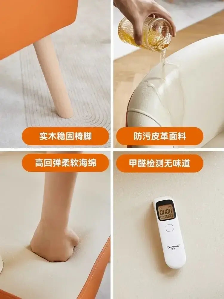 White digital thermometer with a small display screen shown alongside a modern orange and cream leather single sofa chair