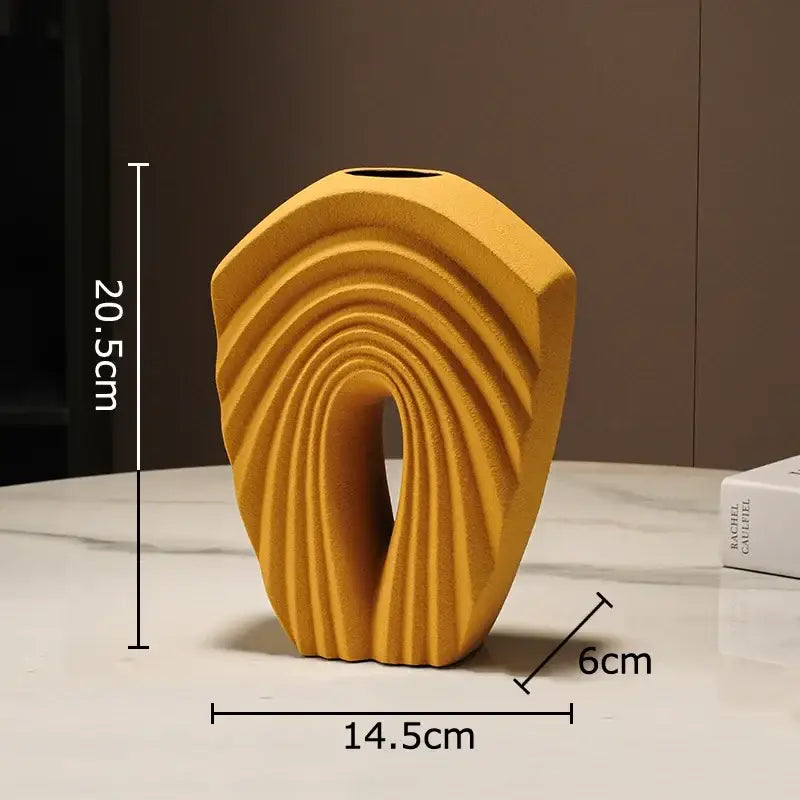 Modern mustard-yellow geometric ceramic vase with curved ribbed design for living room decorbites sculptural decor