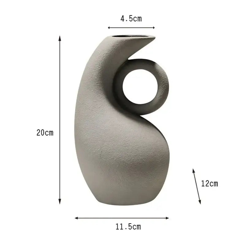 A sleek matte gray geometric ceramic vase with curved neck and circular handle for modern living room decorbites decor
