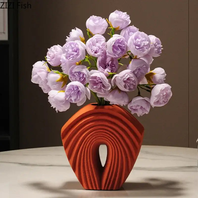 A vibrant orange geometric ceramic vase with concentric ridges and open center for modern decorbites living room decor