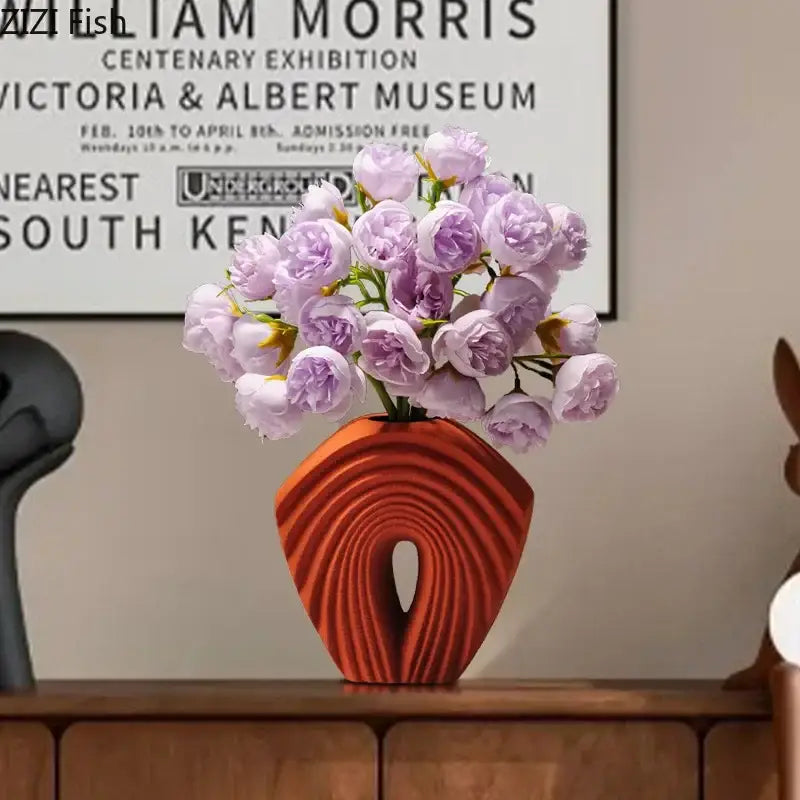 Modern orange geometric ceramic vase with curved ribbed design and lavender artificial roses for living room decorbites geometric ceramic decor