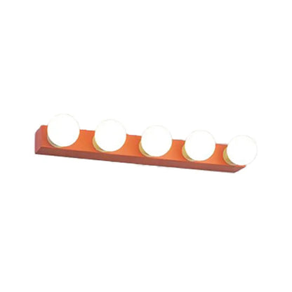 Modern orange rectangular vanity light fixture with five round white bulbs designed for bedroom use
