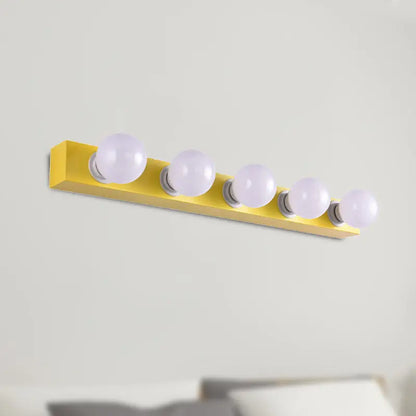 Bright yellow rectangular wall-mounted vanity light fixture with five frosted globe bulbs for bedroom use