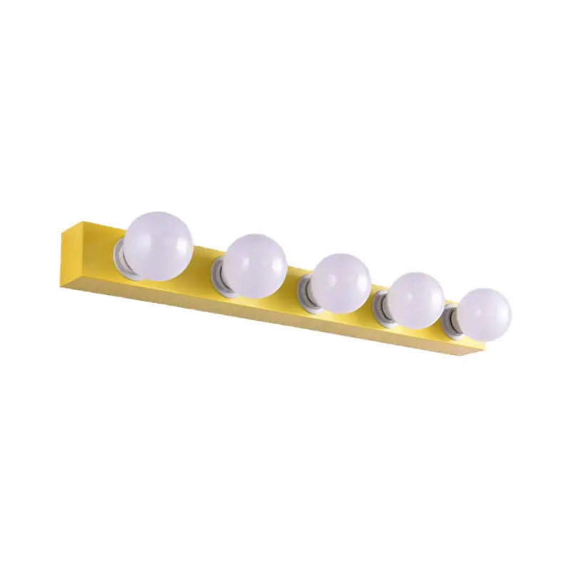 Bright yellow rectangular vanity light fixture with five round white bulbs for modern bedroom use