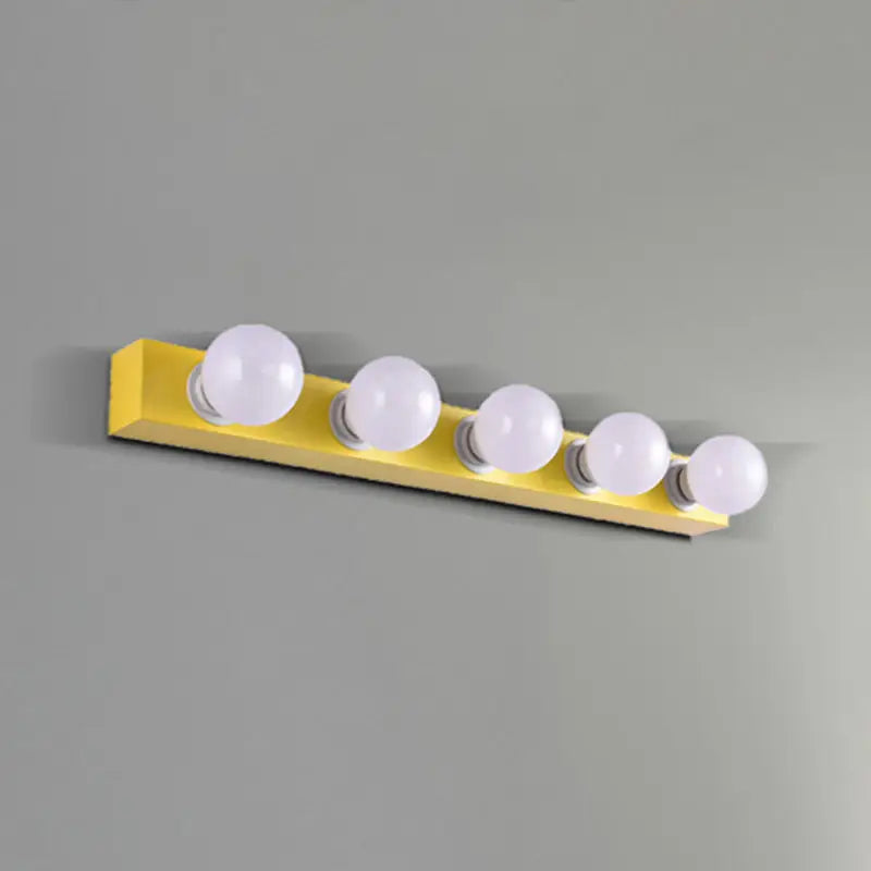 Bright yellow vanity light fixture with five spherical white bulbs for modern bedroom vanity light use