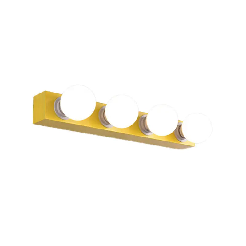 Yellow rectangular vanity light fixture with four frosted glass bulbs for modern bedroom vanity light use