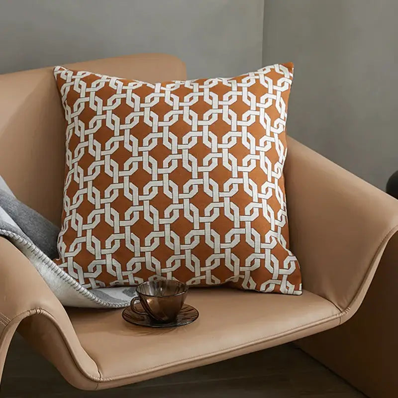 Modern orange and white jacquard crochet pillow cover with geometric chain-link pattern for living room decorbites collection