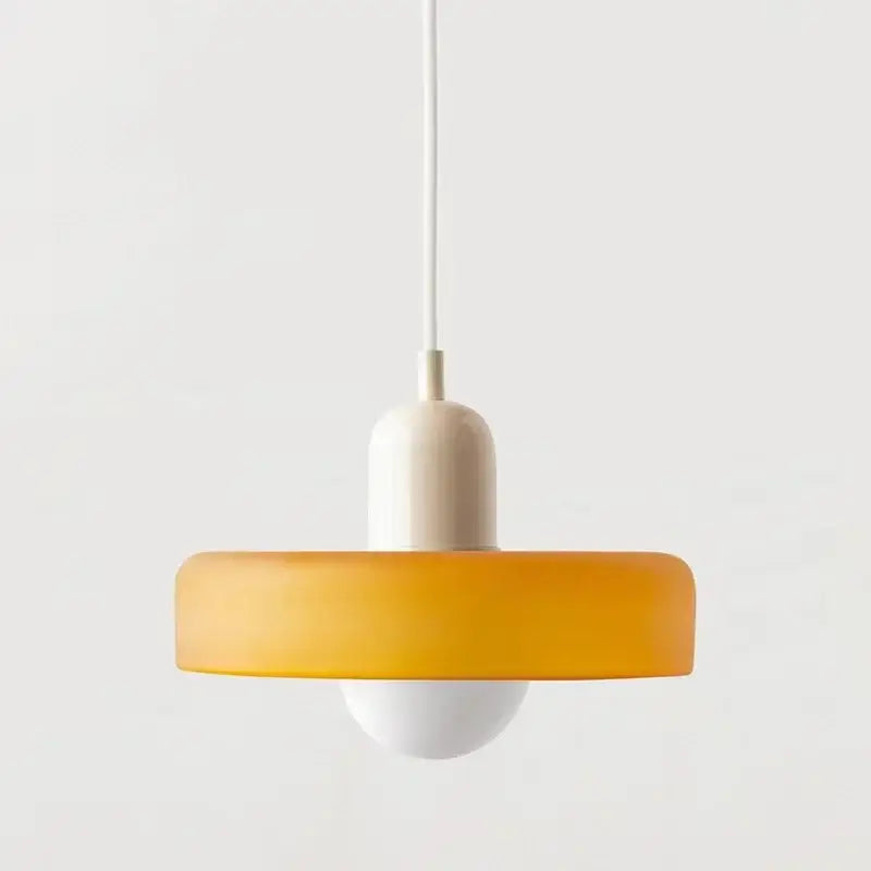 Modern orange and yellow glass led macaron ceiling chandelier with frosted circular shade and white base suspended by cord
