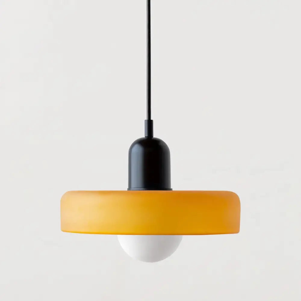 Modern orange and yellow glass led macaron ceiling chandelier with a matte black stem and frosted amber glass ring