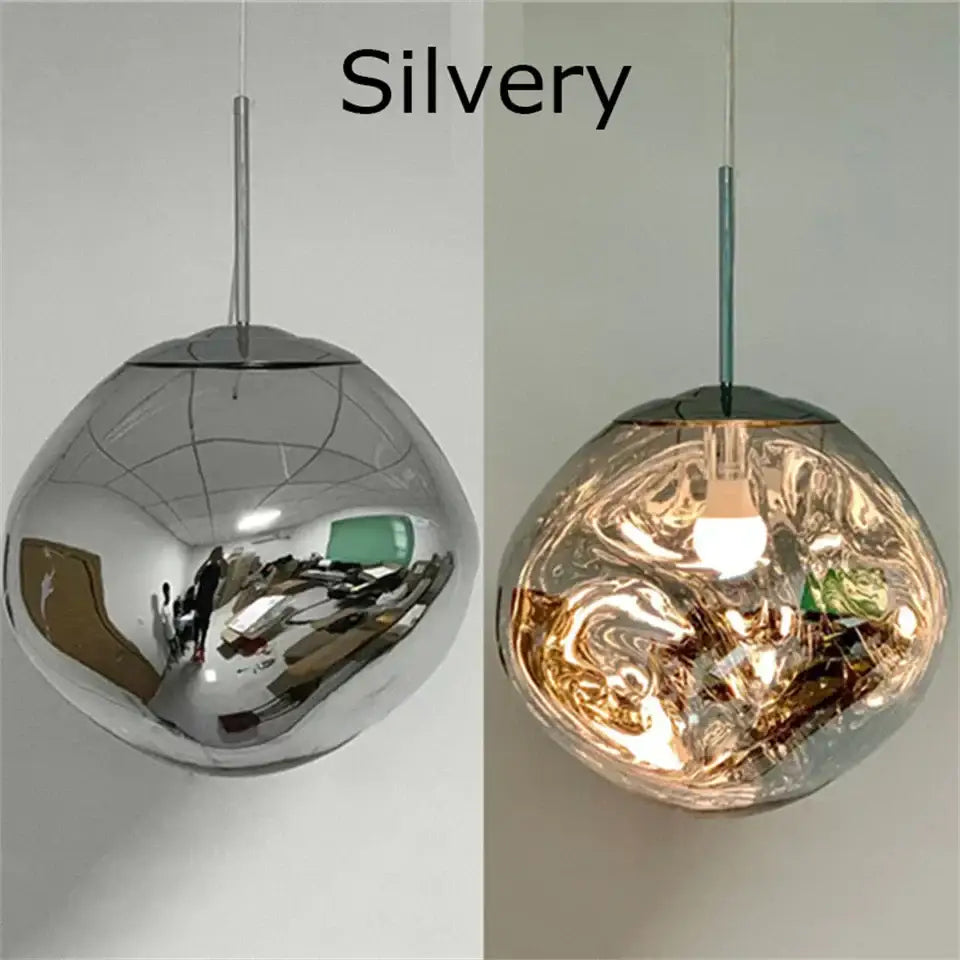 Silver spherical pendant light with reflective mirrored glass finish and chrome plated suspension cord in organic form
