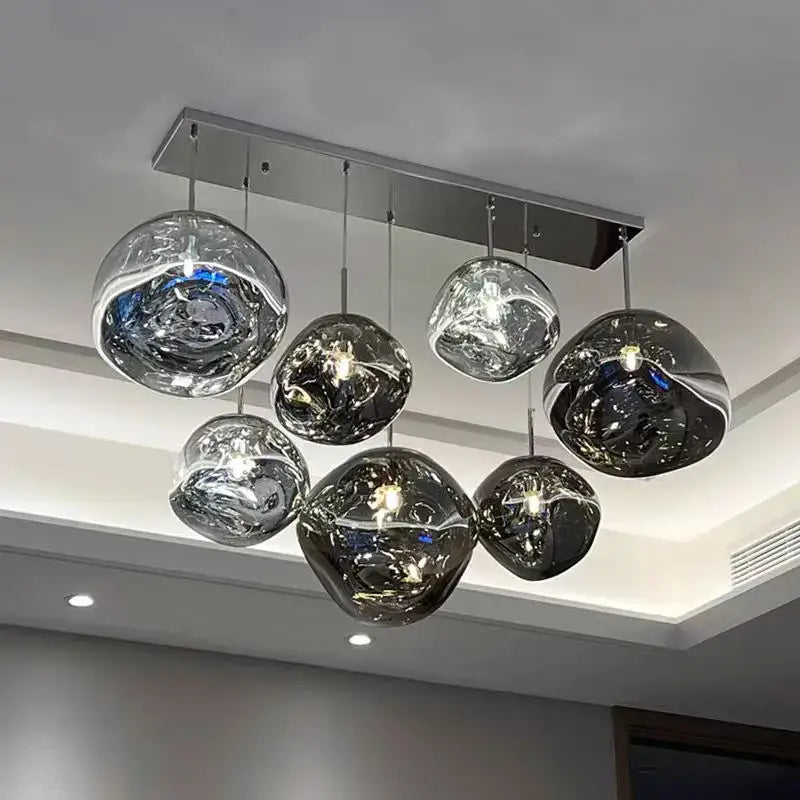 Modern organic form pendant light kitchen trio with chrome plated finish and sleek glass globe design