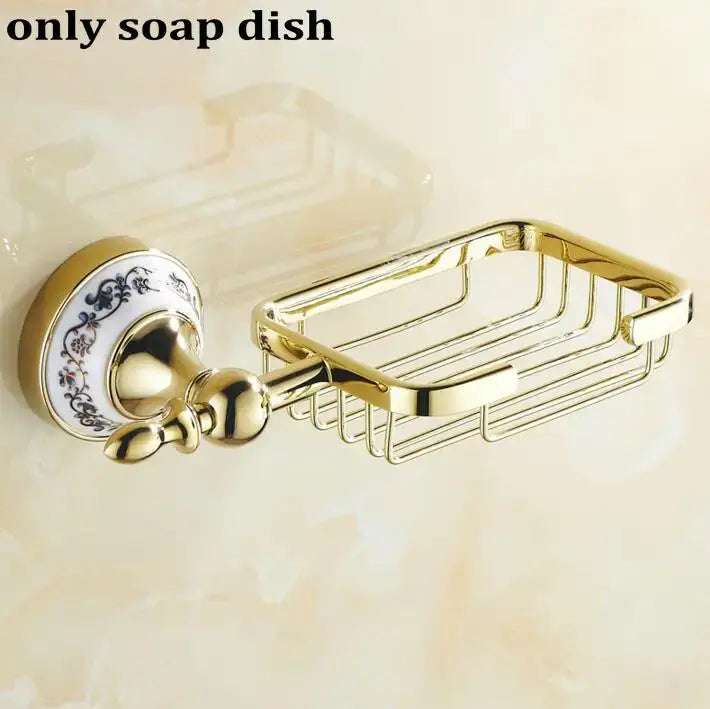 Gold-toned metal soap dish with decorative blue floral ceramic plate in modern ornate gold and white porcelain bath hardware set