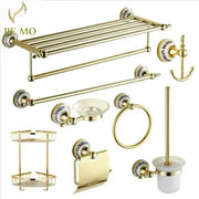 Modern ornate gold and white porcelain bath hardware set featuring gold-toned hardware with ceramic accents