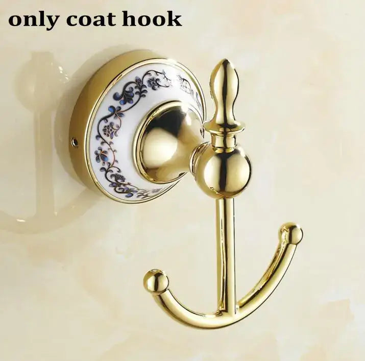 Modern ornate gold and white porcelain bath hardware set featuring a gold coat hook with blue floral ceramic backplate