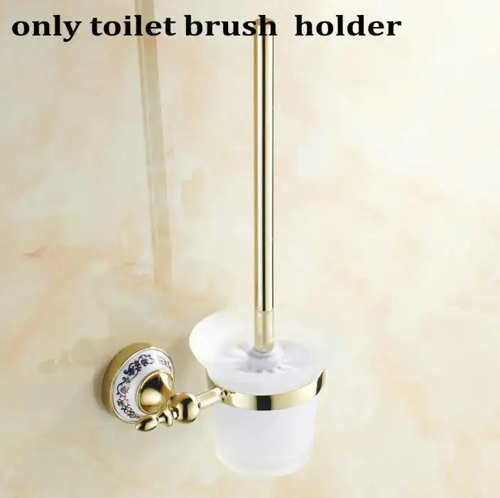 Modern ornate gold and white porcelain toilet brush holder with blue floral mounting plate in bath hardware set