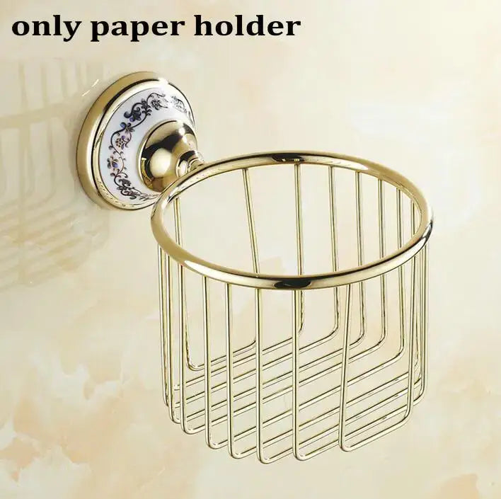 Modern ornate gold and white porcelain bath hardware set featuring a gold-toned metal wire basket with decorative ceramic backplate