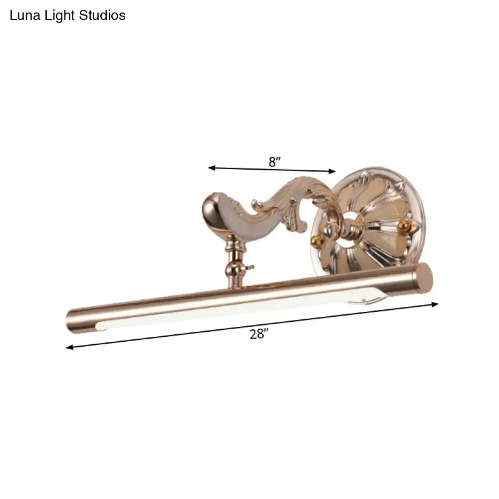 A sleek 28-inch polished brass wall mount bathroom lamp with ornate scrollwork and gold floral design