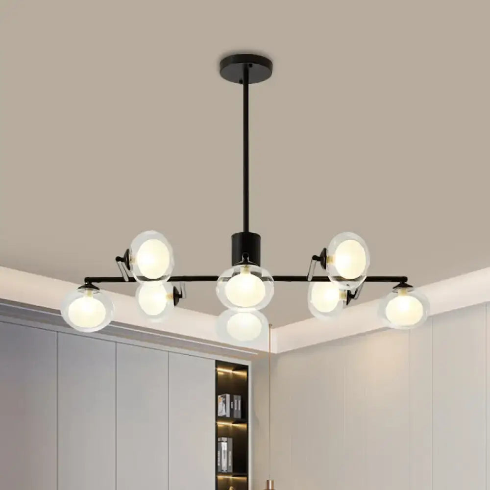 Black metal chandelier with six frosted glass globe lights in black white finish for modern island lighting