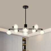 Black metal chandelier with six frosted glass globe lights in black white finish for modern island lighting