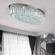 A modern oval chrome and gold crystal ceiling light with cascading prisms for dining room decorbites crystal dining