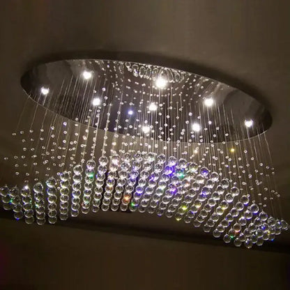 Modern oval flush mount chandelier with cascading clear and multicolored glass beads on a sleek metallic frame